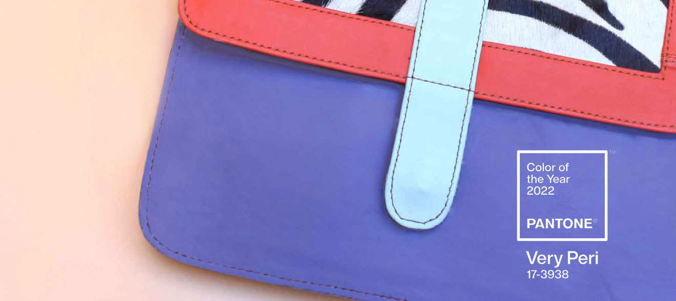 A handbag by Soruka and the Pantone Very Peri logo.